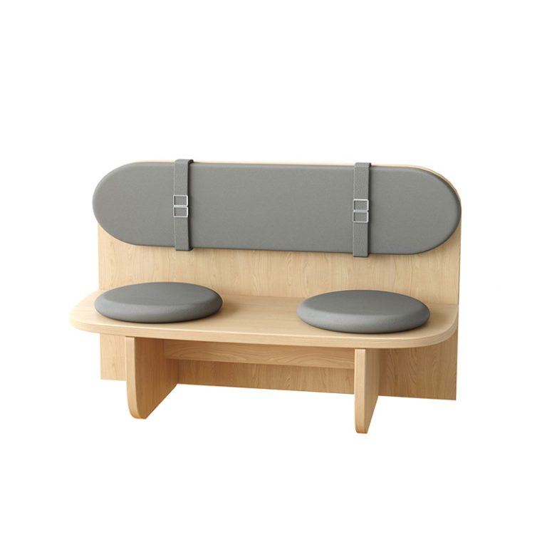 Minimalist wooden bench with gray upholstered back and round seat pads