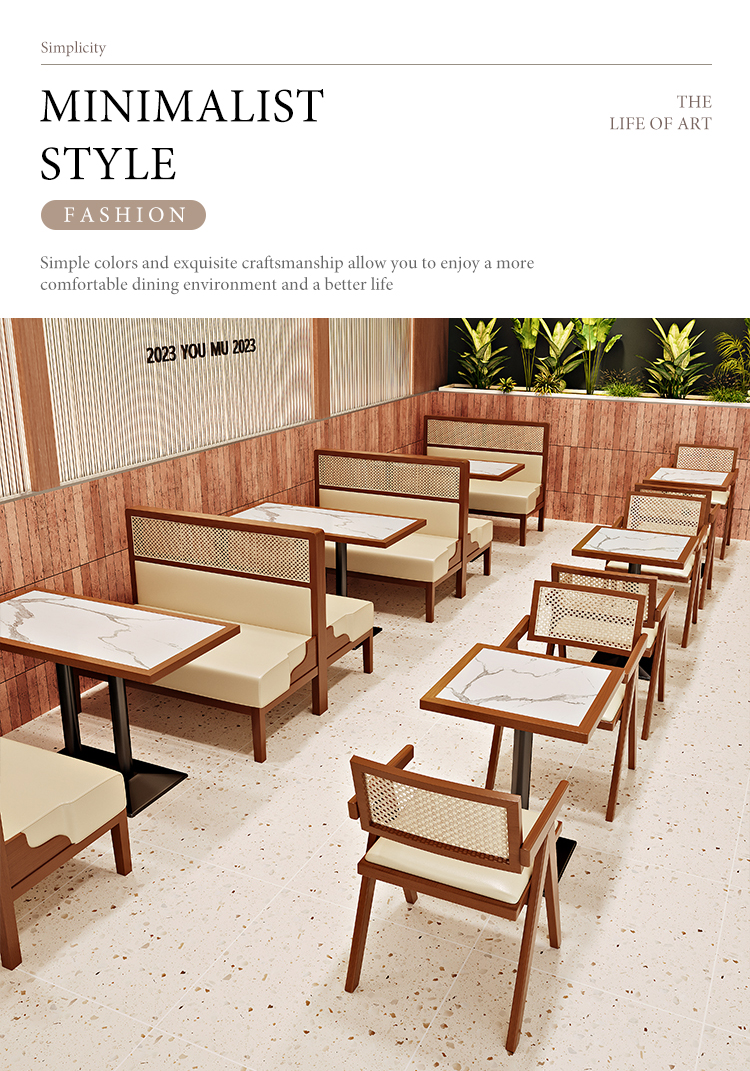 Minimalist cafe furniture with marble tables, wooden booth seating, and chairs featuring rattan backrests, creating a stylish and comfortable dining atmosphere.