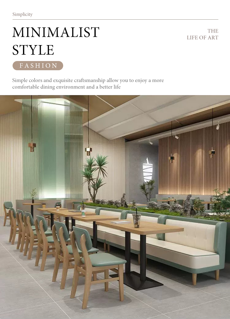 Minimalist cafe design featuring booth seating, wooden chairs, and greenery dividers, creating a stylish and relaxing dining environment.