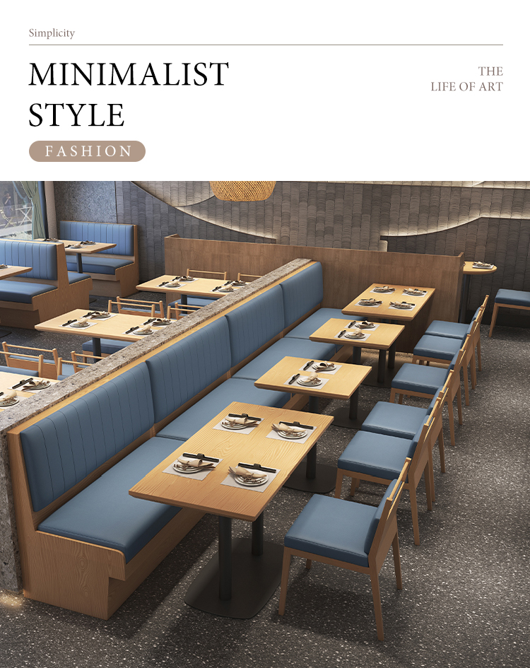 A modern dining area featuring wooden booth seating with blue cushioned backs and seats, paired with matching wooden chairs and rectangular wooden tables. 