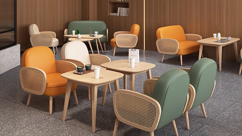 Cozy modern cafe with colorful wooden chairs and tables, minimalist design, and a warm ambiance.