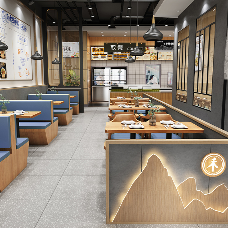 Modern dining area with blue cushioned bench seating, multi-layered wood veneer tables, and sleek lighting design for cozy dining.