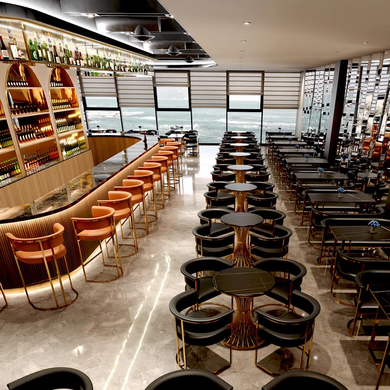 Bar stools with golden frame and orange cushions, placed at a sleek bar with a modern design.