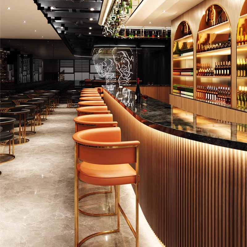 Modern bar interior featuring orange and black stools with gold accents, against a stunning backdrop.